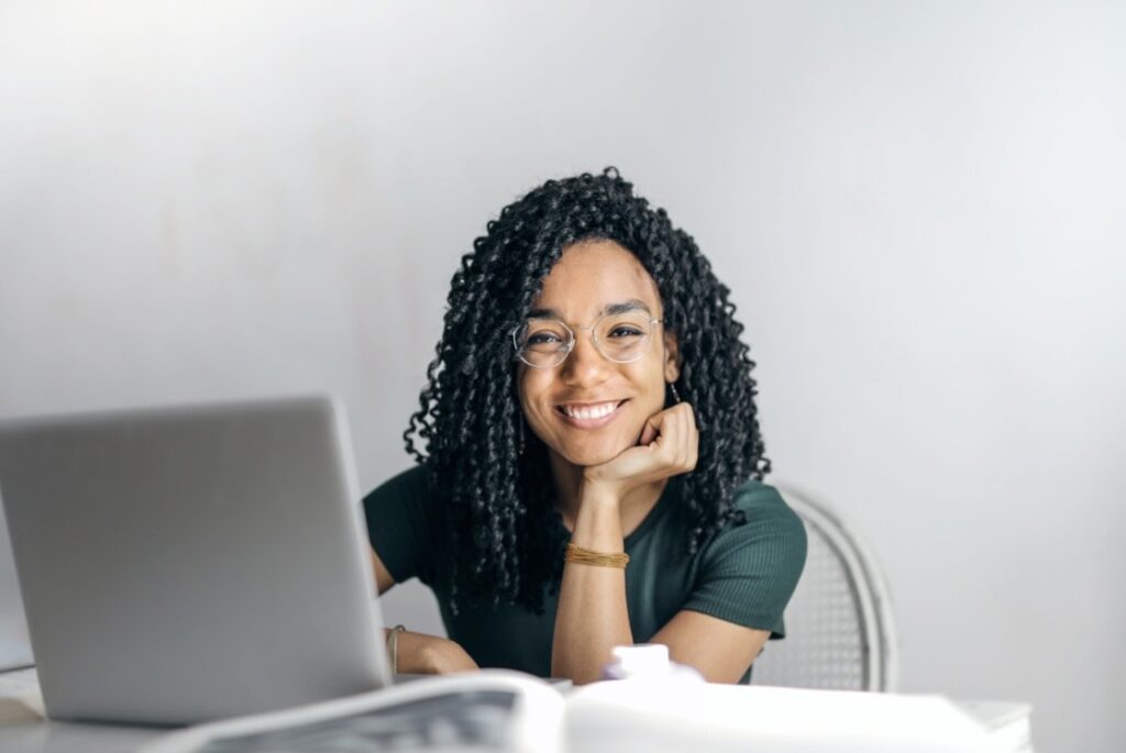 Woman smiling at computer
